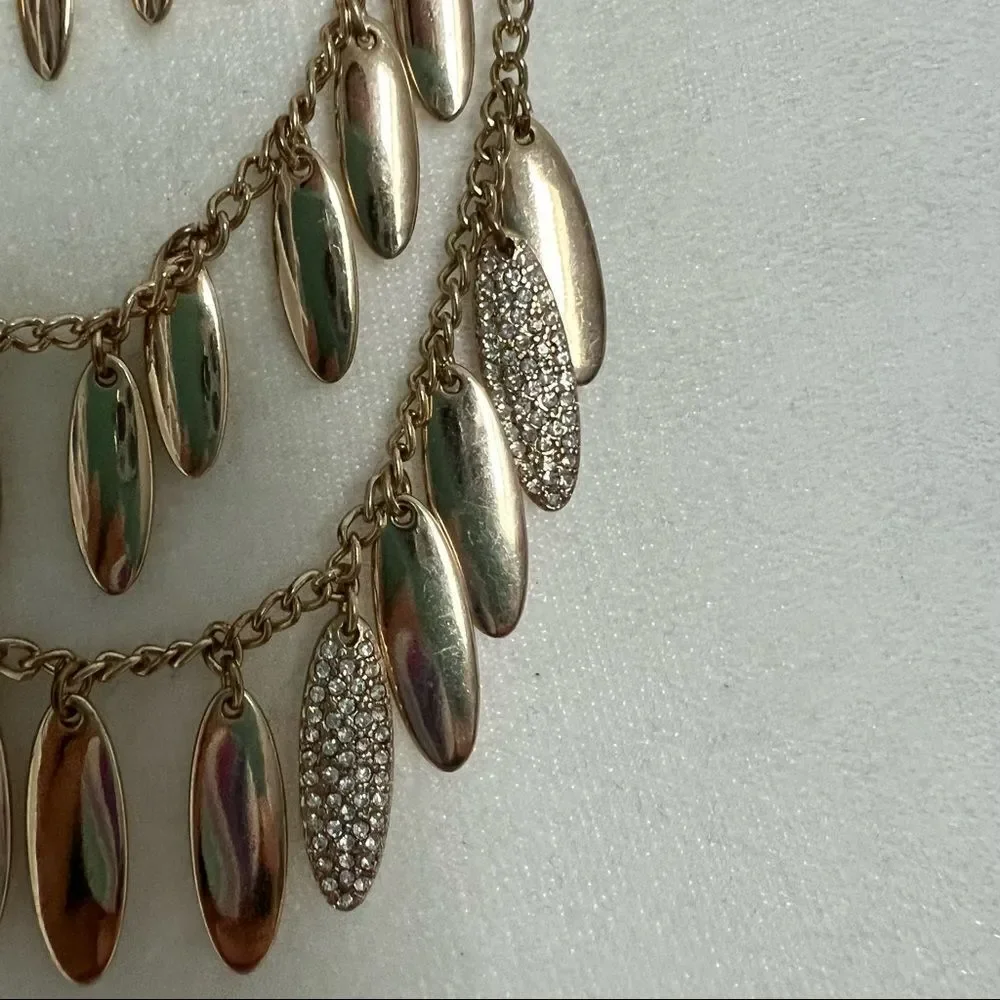 Triple strand gold and rhinestone studded petal necklace